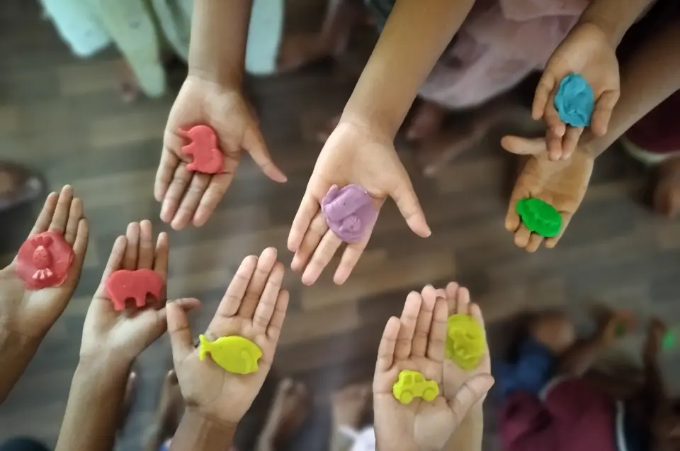 Members of the Anwarat Foundation team meeting with community participants
